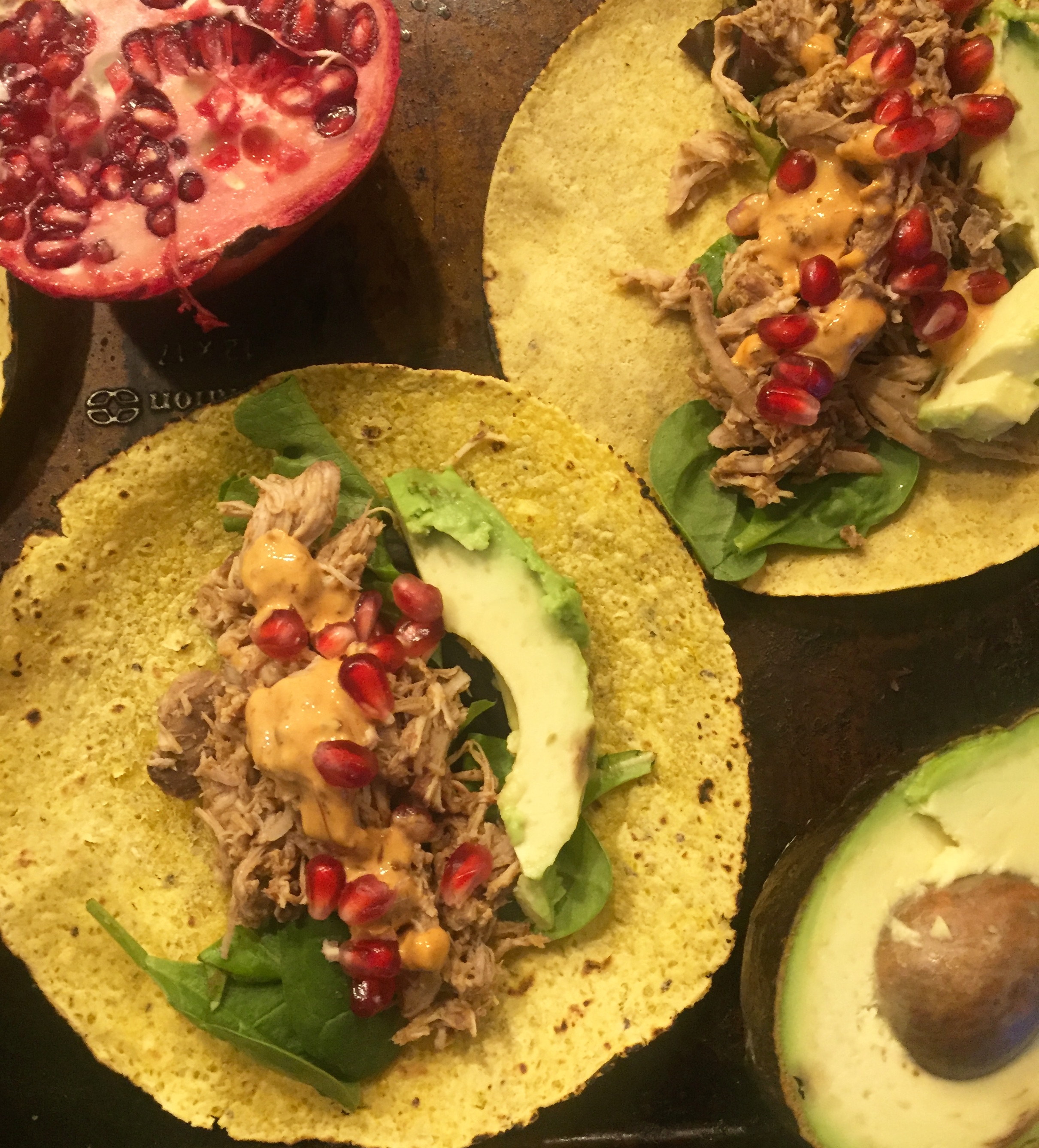 Pomegranate slow-cooker chicken tacos with toppings